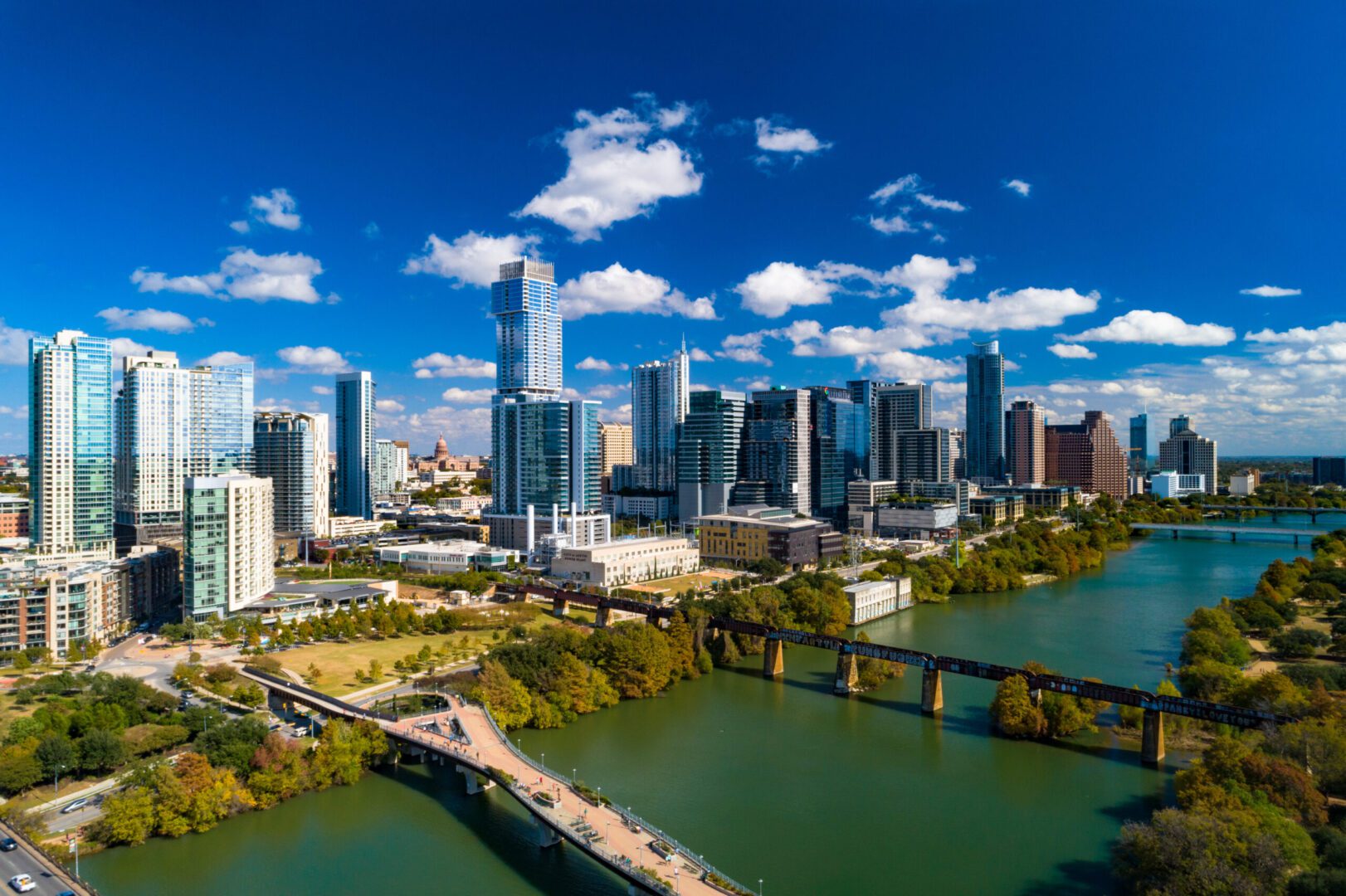 Austin Downtown Skyline Aerial View With Lake And Blue Sky
